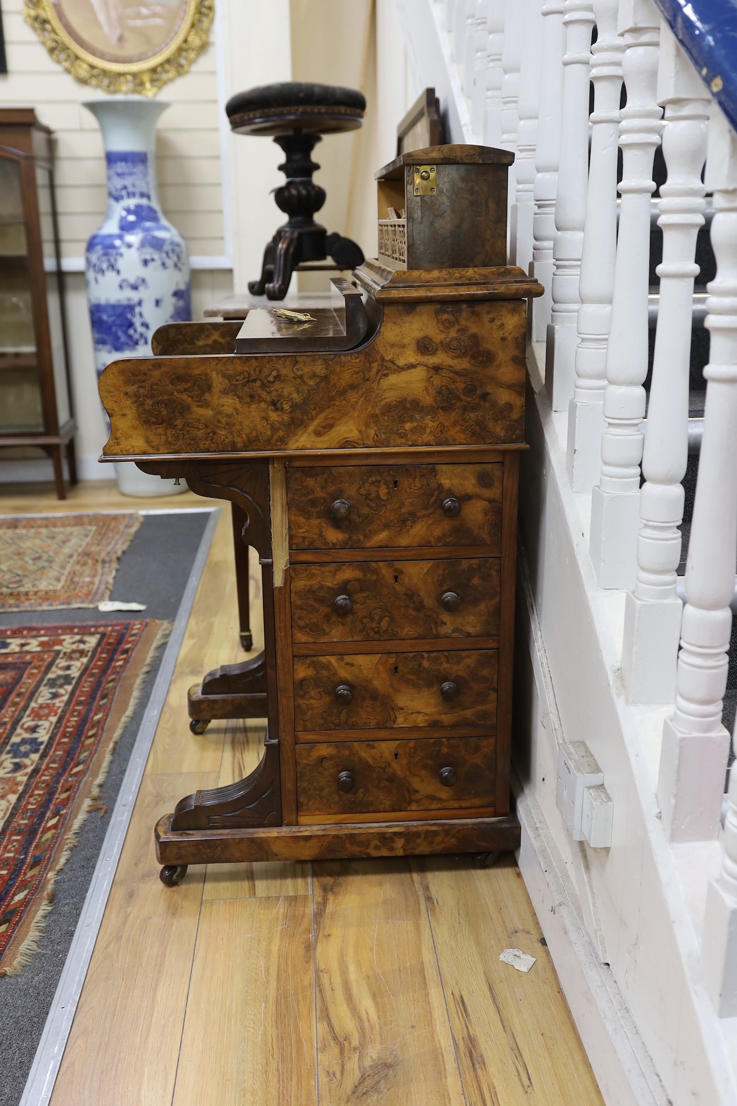 A late Victorian Maple & Co. burr walnut pop-up Davenport, width 59cm, depth 56cm, height 104cm